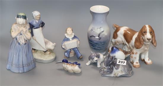 Seven Royal Copenhagen models, a similar vase and a Bing and Grondahl model of a cocker spaniel